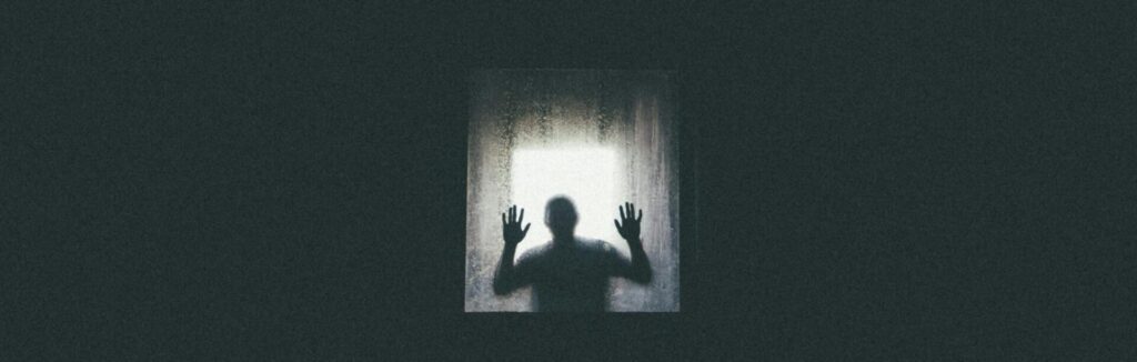Eerie silhouette of a person against a window, conveying themes of isolation and entrapment.